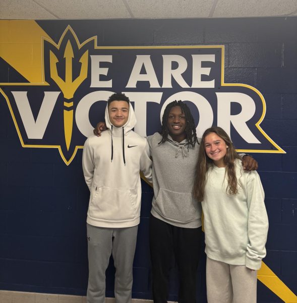 Left to right: Varsity athletes Randy Johnson, Eric Young, and Allie Pisano